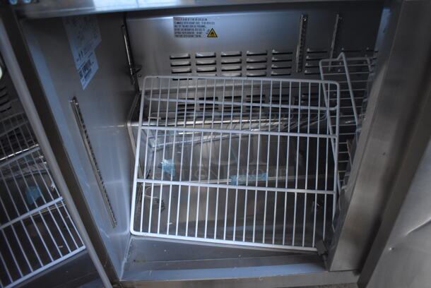 BRAND NEW SCRATCH AND DENT! KoolMore FWT-2D-12C Stainless Steel Commercial 2 Door Work Top Freezer on Commercial Casters. 115 Volts, 1 Phase. 48x30x40. Tested and Working! - Image 4 of 5