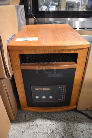 Sun Twin 1500 Elite Wood Pattern Portable Heater on Casters. 120 Volts, 1 Phase. 13.5x19.5x17.5. Tested and Powers On But Does Not Get Warm