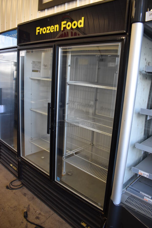 2015 True GDM-49F-LD Metal Commercial 2 Door Reach In Freezer Merchandiser. 115/208-230 Volts, 1 Phase. 54x31.5x78