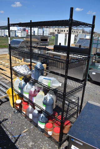 Black Finish 5 Tier Wire Shelving Unit w/ Contents. BUYER MUST DISMANTLE. PCI CANNOT DISMANTLE FOR SHIPPING. PLEASE CONSIDER FREIGHT CHARGES. 48x18x69