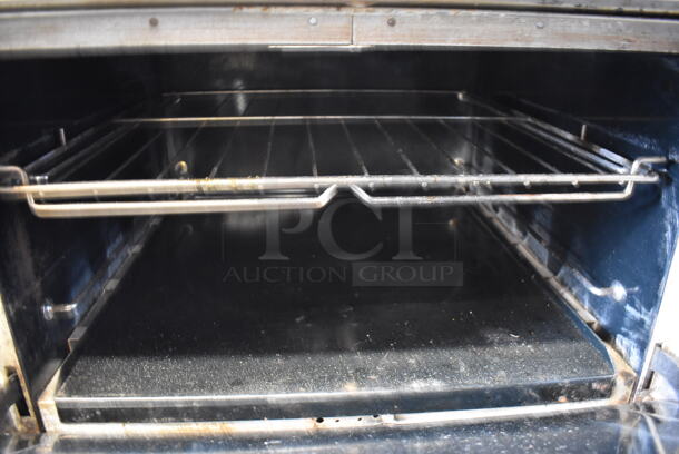 Southbend Stainless Steel Commercial Natural Gas Powered 6 Burner Range w/ Oven, Over Shelf and Back Splash on Commercial Casters. Missing Burners. 36x34x58 - Image 5 of 5