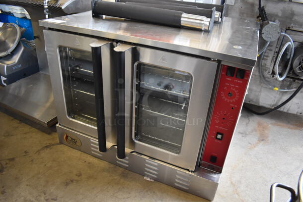 BRAND NEW SCRATCH AND DENT! Cooking Performance Group FGC 100 Stainless Steel Commercial Natural Gas Powered Single Deck Standard Depth Full Size Convection Oven w/ View Through Doors, Metal Oven Racks and Thermostatic Controls. Unit Has Broken Knobs and Buttons. Comes w/ Legs. 54,000 BTU. 38x30x30 - Image 2 of 7