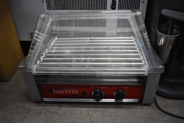 Avantco 177RG1824 Stainless Steel Commercial Countertop Hot Dog Roller w/ Poly Dome Cover. 120 Volts, 1 Phase. 23x15.5x16.5. Tested and Working!