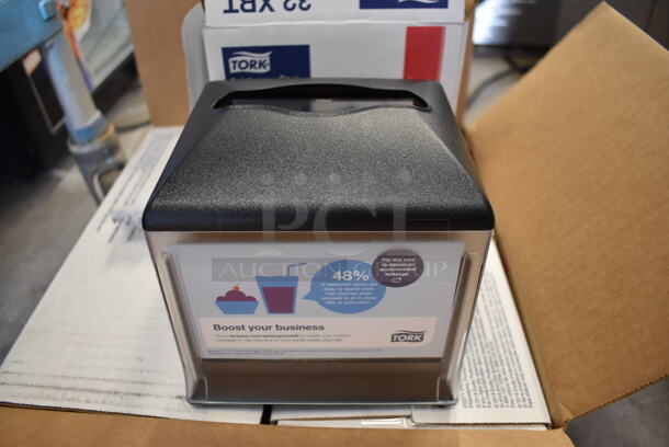 4 BRAND NEW IN BOX! Tork Xpressnap Black and Clear Poly Napkin Dispensers. 6.5x6.5x6.5. 4 Times Your Bid!