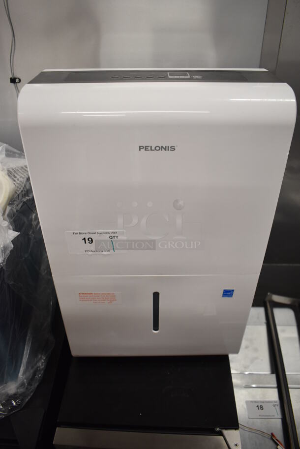 BRAND NEW SCRATCH AND DENT! Pelonis PAD40C1AWT Metal Portable Dehumidifier on Casters. 115 Volts, 1 Phase. 15.5x11x24. Tested and Working! - Image 1 of 6
