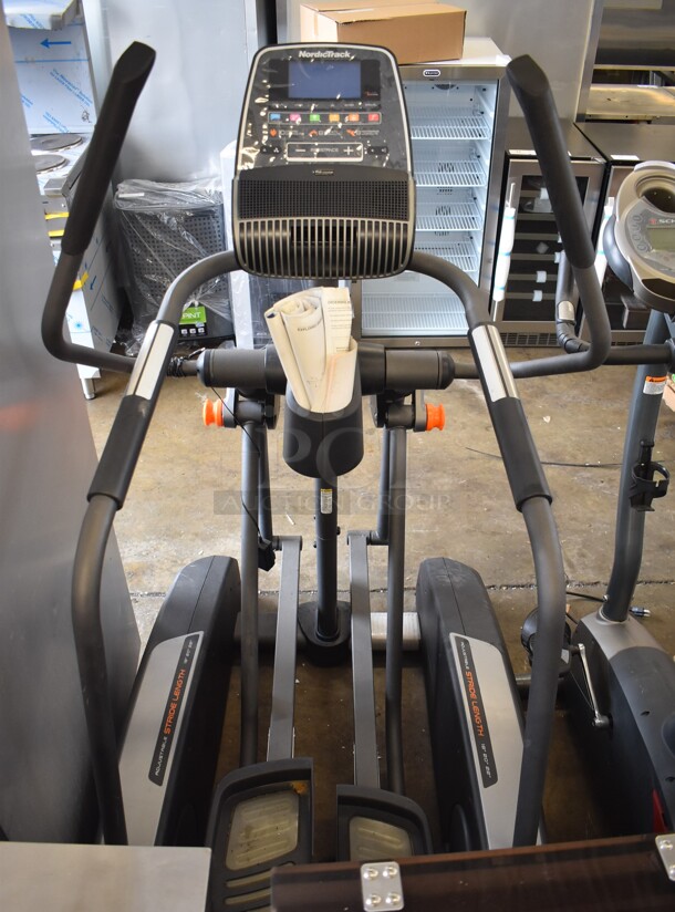 NordicTrack Metal Commercial Floor Style Elliptical Exercise Machine. 36x52x62. Tested and Working But Screens Do Not Power On