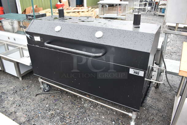 BRAND NEW SCRATCH AND DENT! Backyard Pro 554SMOKR60AS Metal Commercial Charcoal / Wood Smoker Grill with Adjustable Grates and Dome on Commercial Casters. Missing Hardware. 72x31x50 - Image 1 of 7