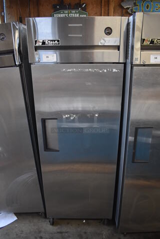 2011 True TG1F-1S Stainless Steel Commercial Single Door Reach In Freezer w/ Poly Coated Racks on Commercial Casters. 115 Volts, 1 Phase. 29x35x83. Tested and Working!