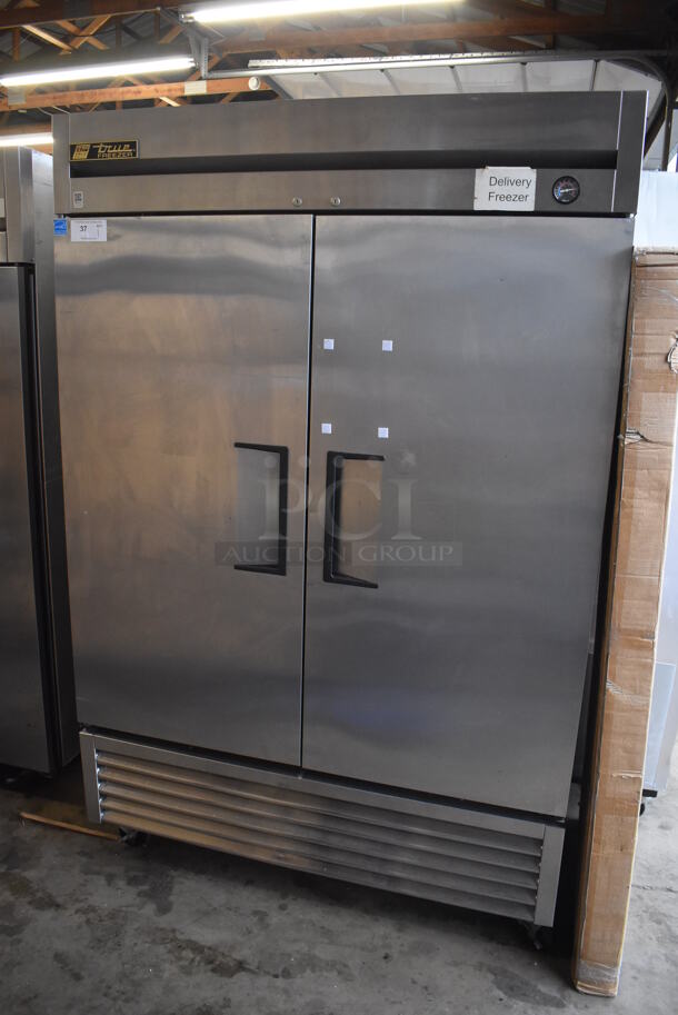 2013 True T-49F ENERGY STAR Stainless Steel Commercial 2 Door Reach In Freezer w/ Poly Coated Racks on Commercial Casters. 115 Volts, 1 Phase. 54x30x83. Tested and Working! - Image 1 of 7
