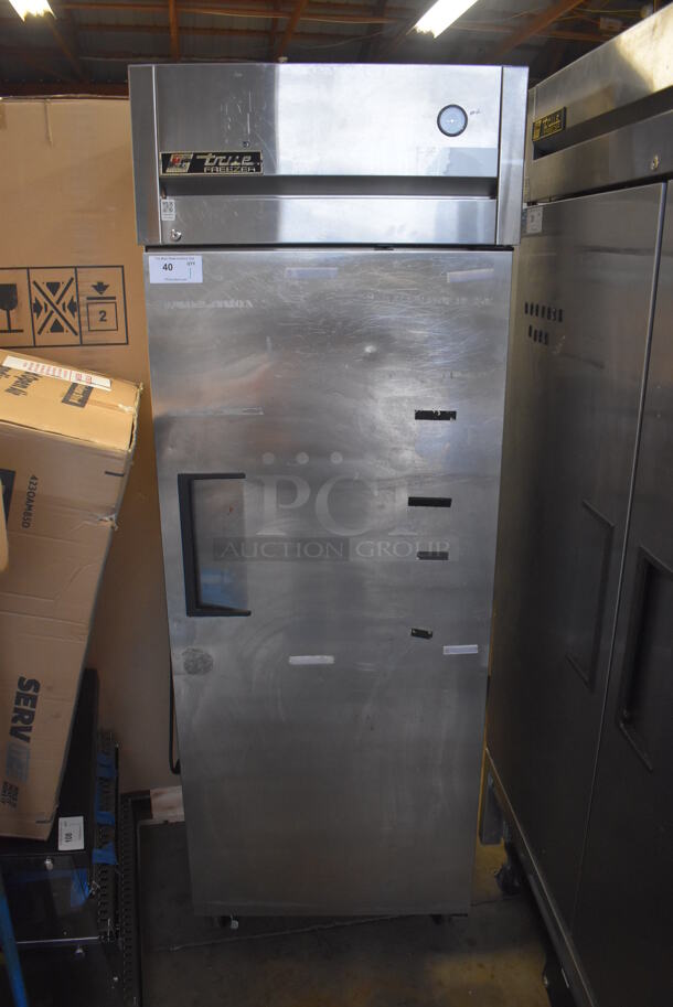 2011 True TG1F-1S Stainless Steel Commercial Single Door Reach In Freezer w/ Poly Coated Racks on Commercial Casters. 115 Volts, 1 Phase. 29x35x83. Tested and Working!