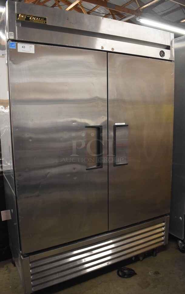 2013 True T-49F ENERGY STAR Stainless Steel Commercial 2 Door Reach In Freezer w/ Poly Coated Racks on Commercial Casters. 115 Volts, 1 Phase. 54x30x83. Tested and Does Not Power On