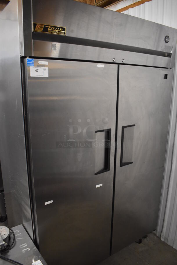 2013 True TG2R-2S ENERGY STAR Stainless Steel Commercial 2 Door Reach In Cooler w/ Poly Coated Racks on Commercial Casters. 115 Volts, 1 Phase. 51x35x83. Tested and Powers On But Does Not Get Cold - Image 1 of 5