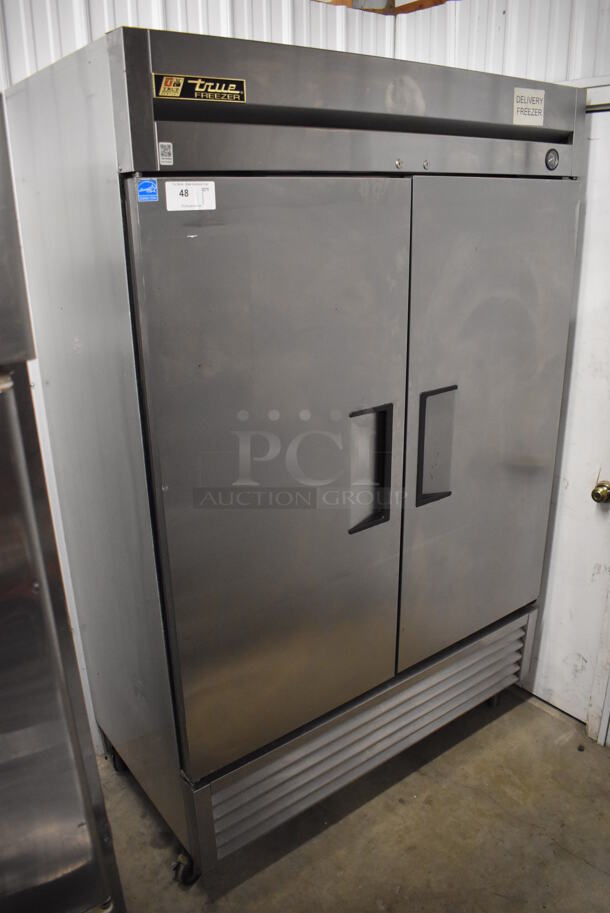 2013 True T-49F ENERGY STAR Stainless Steel Commercial 2 Door Reach In Freezer w/ Poly Coated Racks on Commercial Casters. 115 Volts, 1 Phase. 54x30x83. Tested and Working! - Image 1 of 6