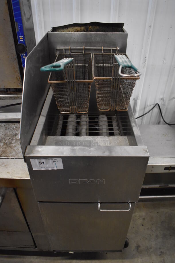 Dean Stainless Steel Commercial Floor Style Natural Gas Powered Deep Fat Fryer w/ 2 Metal Fry Baskets and Side Splash Guard on Commercial Casters. 15.5x30x44