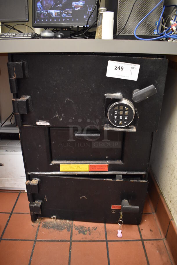 Black Metal 2 Compartment Safe. Comes w/ Combination and Key. BUYER MUST REMOVE. (Office)