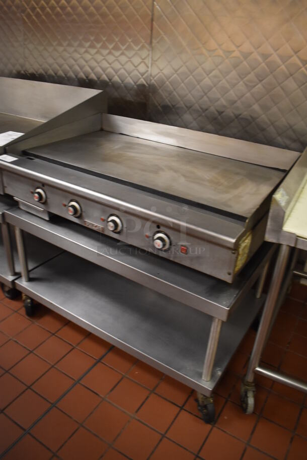 Vulcan Stainless Steel Commercial Countertop Natural Gas Powered Flat Top Griddle on Stainless Steel Equipment Stand w/ Under Shelf and Commercial Casters. Unit Was In Working Condition When Restaurant Closed. BUYER MUST REMOVE. (Front Kitchen) - Image 2 of 8