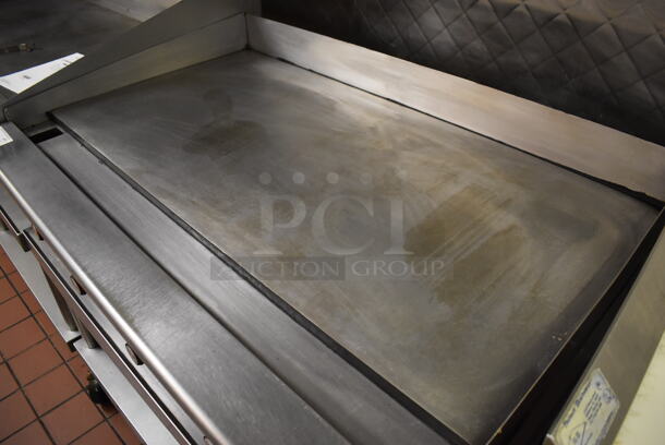 Vulcan Stainless Steel Commercial Countertop Natural Gas Powered Flat Top Griddle on Stainless Steel Equipment Stand w/ Under Shelf and Commercial Casters. Unit Was In Working Condition When Restaurant Closed. BUYER MUST REMOVE. (Front Kitchen) - Image 4 of 8