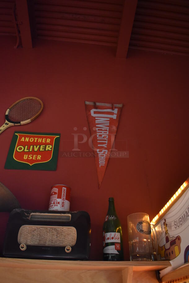 ALL ONE MONEY! Shelf Lot of Various Items Including Bottles and Helmet and Wall Decor Above The Shelf. Does Not Include The Shelf Itself or The Television. BUYER MUST REMOVE. (Dining Room) - Image 2 of 4