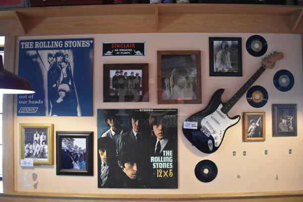 ALL ONE MONEY! Wall Lot of Various Pictures Including the Rolling Stones and Records. Does Not Include Guitar. BUYER MUST REMOVE. (Dining Room)