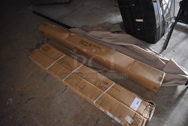 ALL ONE MONEY! Lot of Storage Room Contents Including Patio Umbrellas, Delfield Single Door Undercounter Cooler, Mixing Cups, Baking Pans, POS Monitors, Receipt Printers, Signs and More! BUYER MUST REMOVE. (Storage Room) - Image 2 of 12