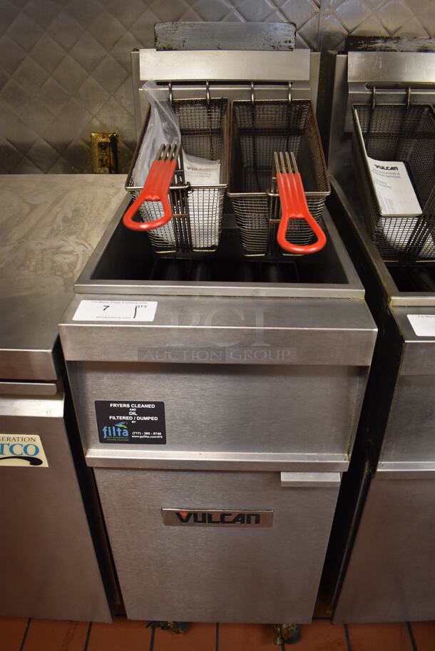 2016 Vulcan 1GR45M Stainless Steel Commercial Floor Style Natural Gas Powered Deep Fat Fryer w/ 2 Metal Fry Baskets on Commercial Casters. 120,000 BTU. Unit Was In Working Condition When Restaurant Closed. BUYER MUST REMOVE. (Front Kitchen)