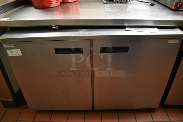 2012 Delfield UC4048 Stainless Steel Commercial 2 Door Undercounter Cooler on Commercial Casters. 115 Volts, 1 Phase. Unit Was In Working Condition When Restaurant Closed. (Front Kitchen)
