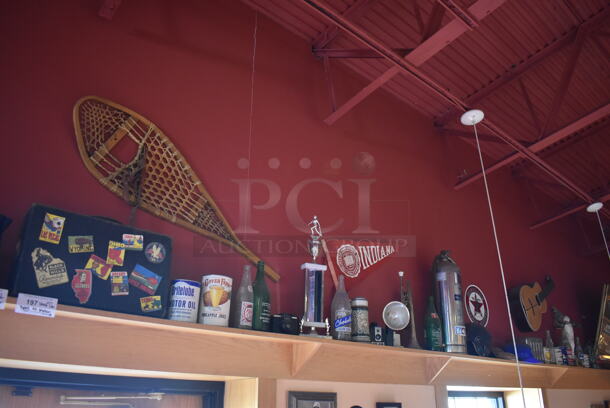 ALL ONE MONEY! Shelf Lot of Various Items Including Bottles, Tank and Luggage and Wall Decor Above The Shelf. Does Not Include The Shelf Itself. BUYER MUST REMOVE. (Dining Room) - Image 1 of 7