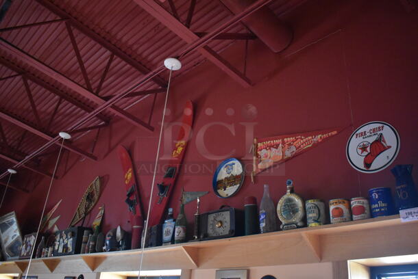 ALL ONE MONEY! Shelf Lot of Various Items Including Bottles, Tank and Luggage and Wall Decor Above The Shelf. Does Not Include The Shelf Itself. BUYER MUST REMOVE. (Dining Room) - Image 1 of 7