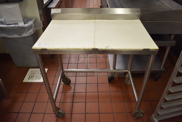 Stainless Steel Table w/ Cutting Board Countertop on Commercial Casters. (Front Kitchen)