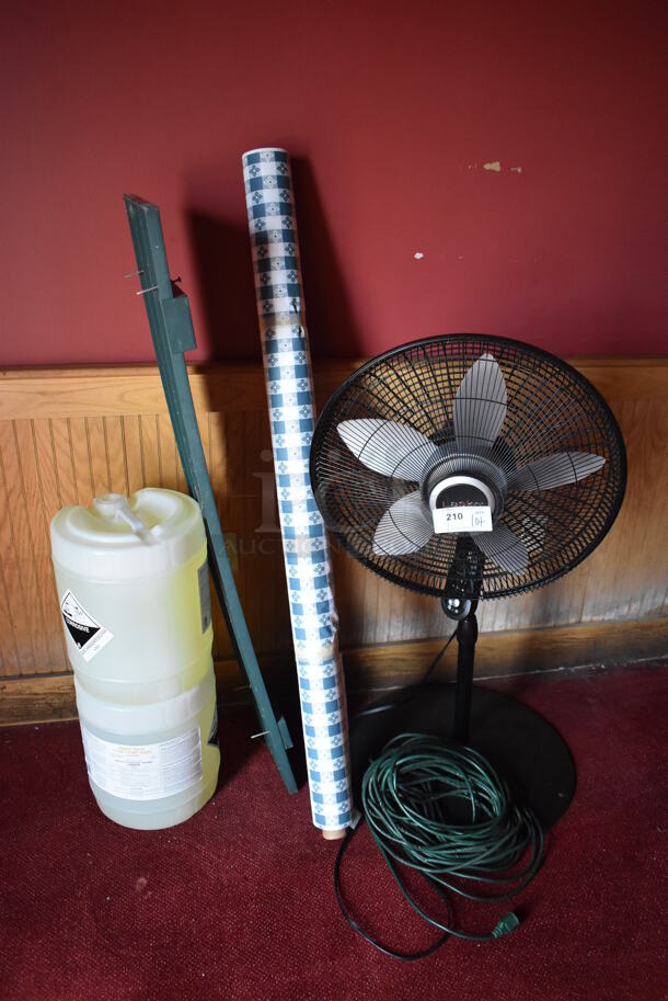 ALL ONE MONEY! Lot of Various Items Including Fan, Tablecloth Roll and 2 Barrels of Cleaner. (Side Dining Room)
