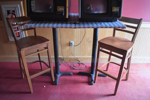 Table w/ Table Cloth on Black Metal Table Base and 2 Wooden Bar Height Chairs. 30x48x42, 17x16x42. (Side Dining Room)