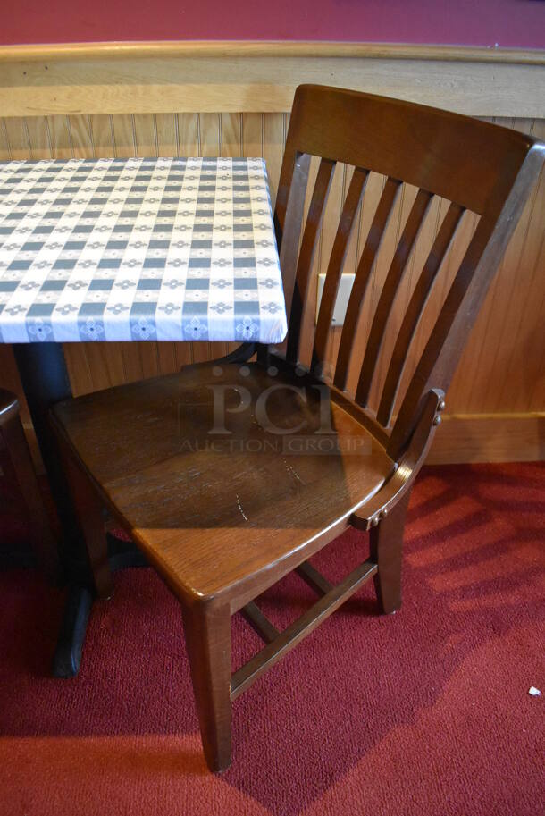 Table w/ Table Cloth on Black Metal Table Base and 2 Wooden Dining Chairs. Stock Picture - Cosmetic Condition May Vary. 30X24X28, 18x16x36. (Dining Room)

 - Image 3 of 4