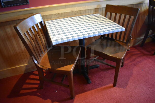 Table w/ Table Cloth on Black Metal Table Base and 2 Wooden Dining Chairs. Stock Picture - Cosmetic Condition May Vary. 30X24X28, 18x16x36. (Dining Room)

 - Image 4 of 4