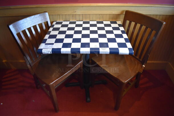 Table w/ Table Cloth on Black Metal Table Base and 2 Wooden Dining Chairs. Stock Picture - Cosmetic Condition May Vary. 30x24x29, 18x16x35. (Party Dining Room)