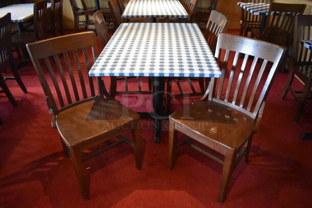 Table w/ Table Cloth on Black Metal Table Base and 4 Wooden Dining Chairs. Stock Picture - Cosmetic Condition May Vary. 30x48x28, 18x16x35. (Party Dining Room)