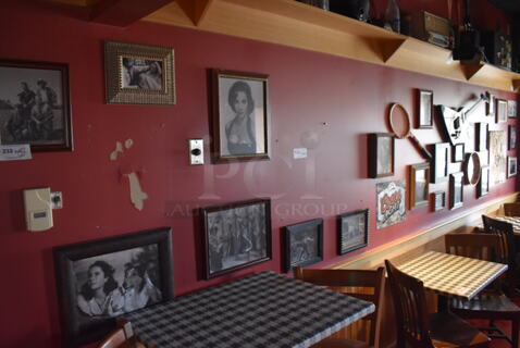 ALL ONE MONEY! Wall Lot of Various Pictures Including Audrey Hepburn, Tennis Racket and Actors. BUYER MUST REMOVE. (Party Dining Room)