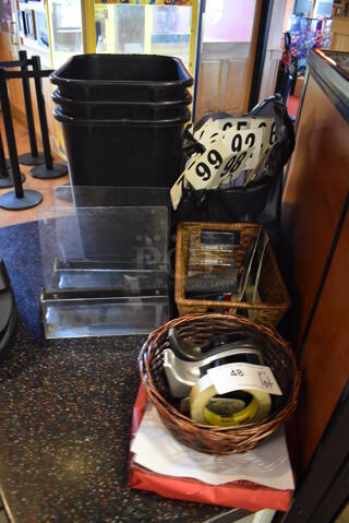 ALL ONE MONEY! Lot of Various Items Including Black Trash Cans, Table Numbers and Tape Dispensers. (Front Kitchen)