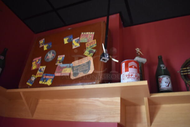 ALL ONE MONEY! Shelf Lot of Various Items Including Bottles and Hats and Wall Decor Above The Shelf. Does Not Include The Shelf Itself. BUYER MUST REMOVE. (Party Dining Room) - Image 7 of 8