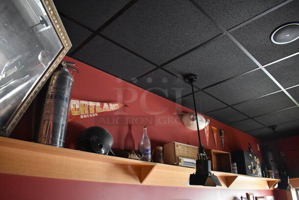 ALL ONE MONEY! Shelf Lot of Various Items Including Helmet and Crates and Wall Decor Above The Shelf. Does Not Include The Shelf Itself. BUYER MUST REMOVE. (Party Dining Room) - Image 1 of 6