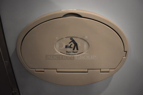 Gray Poly Wall Mount Diaper Changing Station. BUYER MUST REMOVE. (Mens Restroom)