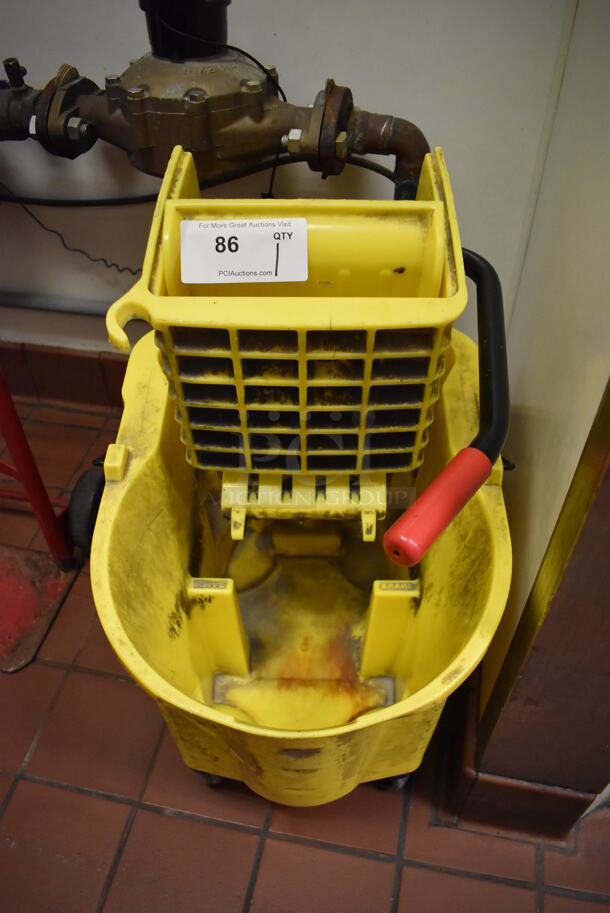Yellow Poly Mop Bucket w/ Wringing Attachment on Casters. (Kitchen) - Image 1 of 4