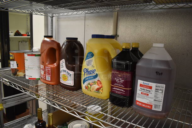 ALL ONE MONEY! Tier Lot of Various Items Including Vanilla Syrup, Olive Oil and BBQ Sauce. (Kitchen) - Image 1 of 4