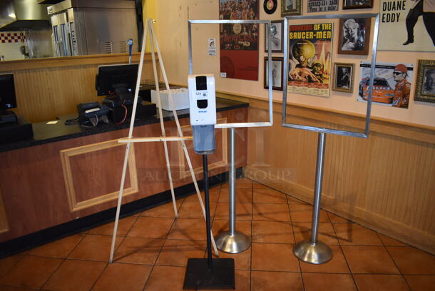 ALL ONE MONEY! Lot of 4 Various Items; 2 Sign Frames, Easel and Hand Sanitizer. BUYER MUST REMOVE. (Lobby) - Image 1 of 4