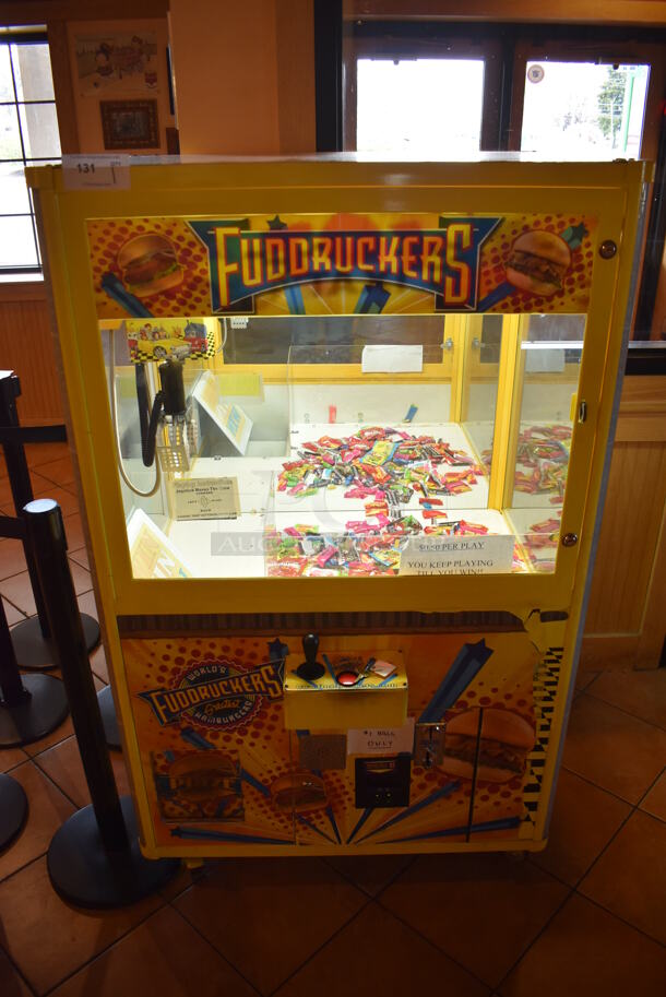 Coast to Coast Entertainment Metal Commercial Floor Style Claw Machine Arcade Game on Commercial Casters. Unit Was In Working Condition When Restaurant Closed. BUYER MUST REMOVE. (Lobby)  - Image 1 of 11