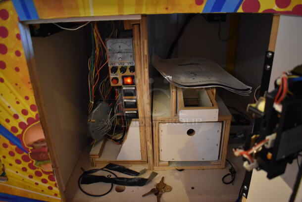 Coast to Coast Entertainment Metal Commercial Floor Style Claw Machine Arcade Game on Commercial Casters. Unit Was In Working Condition When Restaurant Closed. BUYER MUST REMOVE. (Lobby)  - Image 10 of 11