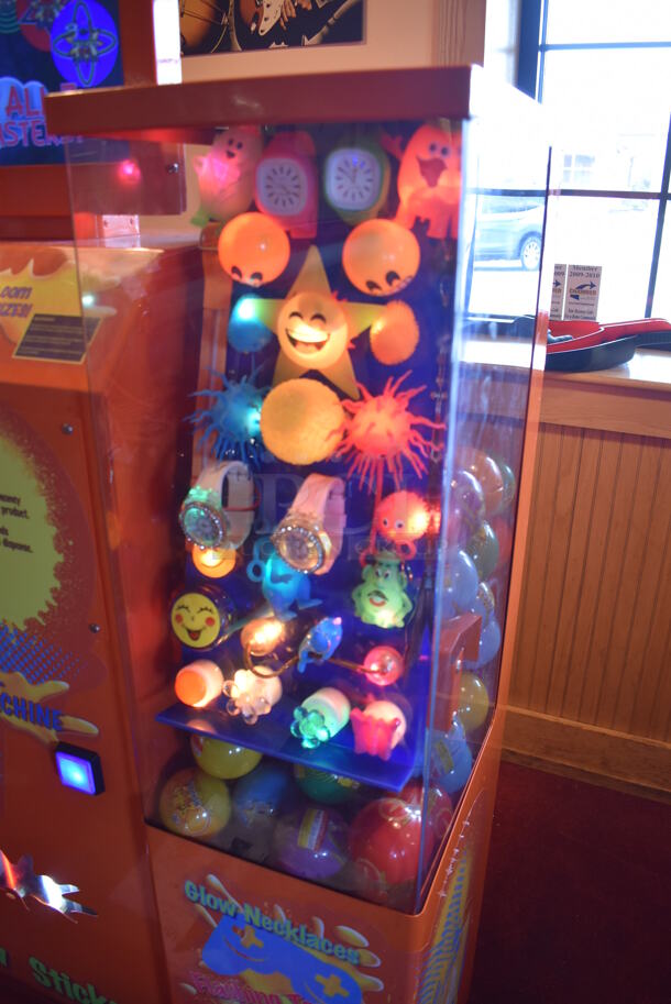 VTail Metal Commercial Floor Style Web Glow Toy Vending Machine on Commercial Casters. Comes w/ Box of Extra Toys. Unit Was In Working Condition When Restaurant Closed. BUYER MUST REMOVE. (Dining Room) - Image 3 of 12