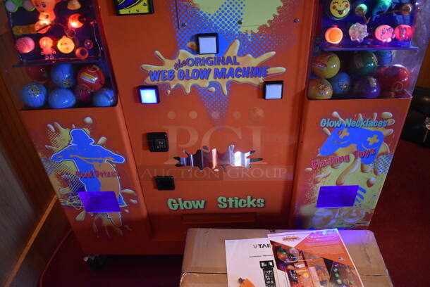VTail Metal Commercial Floor Style Web Glow Toy Vending Machine on Commercial Casters. Comes w/ Box of Extra Toys. Unit Was In Working Condition When Restaurant Closed. BUYER MUST REMOVE. (Dining Room) - Image 9 of 12