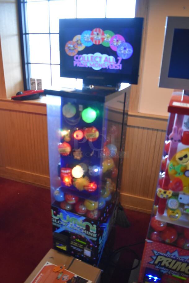 Lumini Metal Commercial Floor Style Glow Toy Vending Machine w/ Cash Acceptor. Comes w/ Box of Extra Toys. 110 Volts, 1 Phase. Unit Was In Working Condition When Restaurant Closed. BUYER MUST REMOVE. (Dining Room) - Image 3 of 9