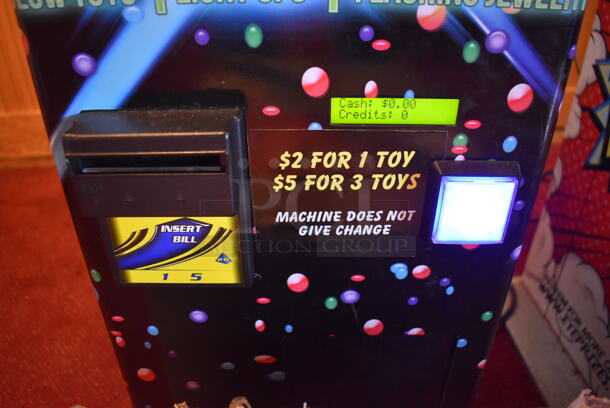 Lumini Metal Commercial Floor Style Glow Toy Vending Machine w/ Cash Acceptor. Comes w/ Box of Extra Toys. 110 Volts, 1 Phase. Unit Was In Working Condition When Restaurant Closed. BUYER MUST REMOVE. (Dining Room) - Image 8 of 9