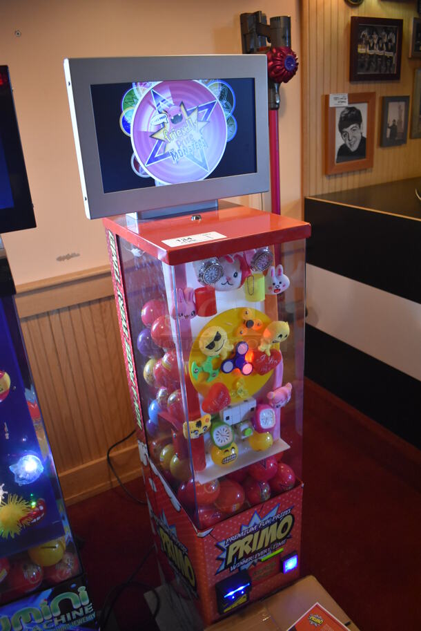 Lumini Metal Commercial Floor Style Glow Toy Vending Machine w/ Cash Acceptor. Comes w/ Box of Extra Toys. 110 Volts, 1 Phase. Unit Was In Working Condition When Restaurant Closed. BUYER MUST REMOVE. (Dining Room) - Image 4 of 8
